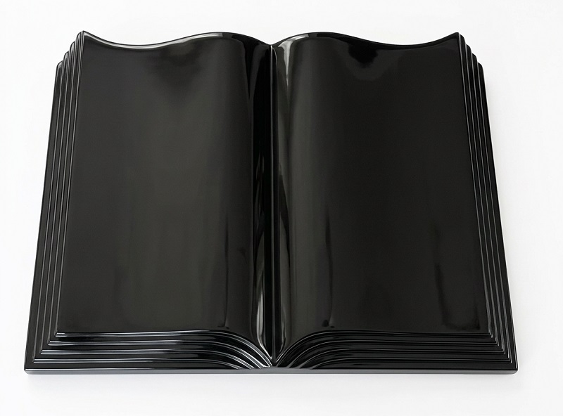 Black granite open book memorial with polished sculpted page edges