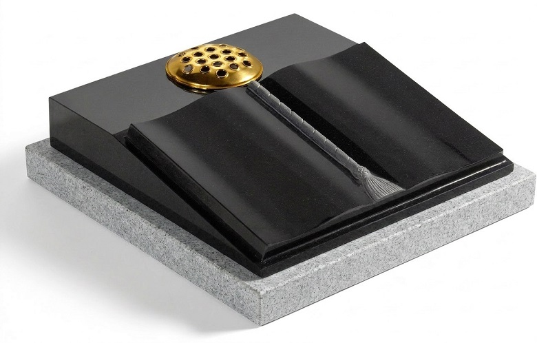 Black granite raised open book memorial with carved cord and tassel detail and flower holder
