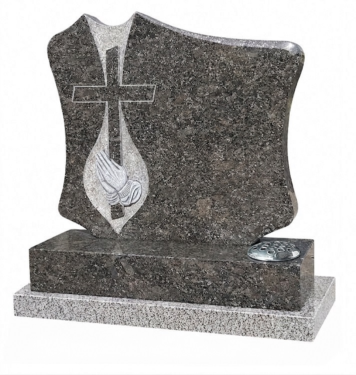 Butterfly Blue granite headstone with carved cross and praying hands design