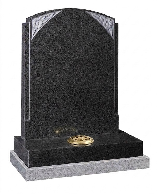 Dark grey granite headstone with rebated edges and carved floral corner details