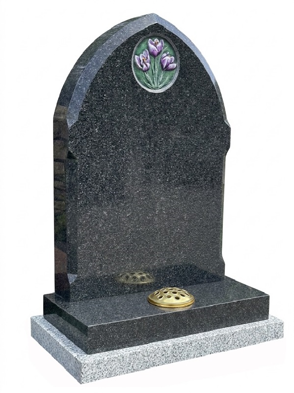 Flint grey granite gothic memorial headstone with polished bevelled edges and purple tulip floral carving