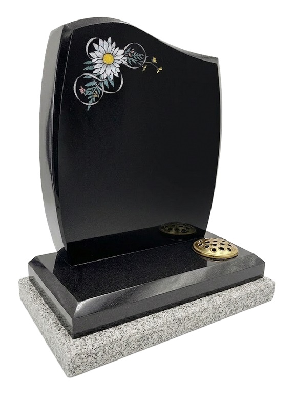 Black granite curved memorial headstone with white daisy flower design and twin flower containers
