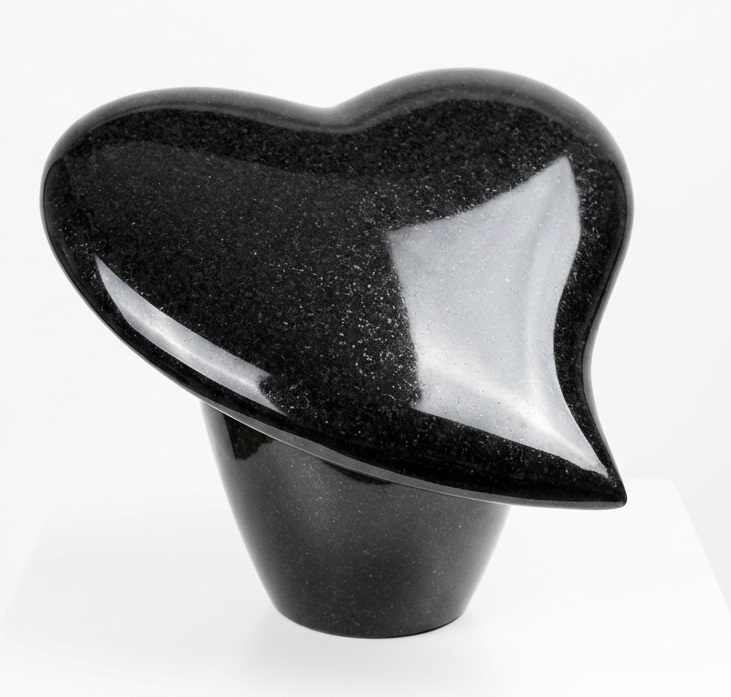 Polished black granite teardrop heart memorial ornament on integrated vase base